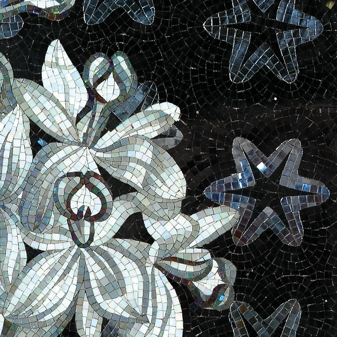 Green mosaic covering a bathroom, completing an elegant design.